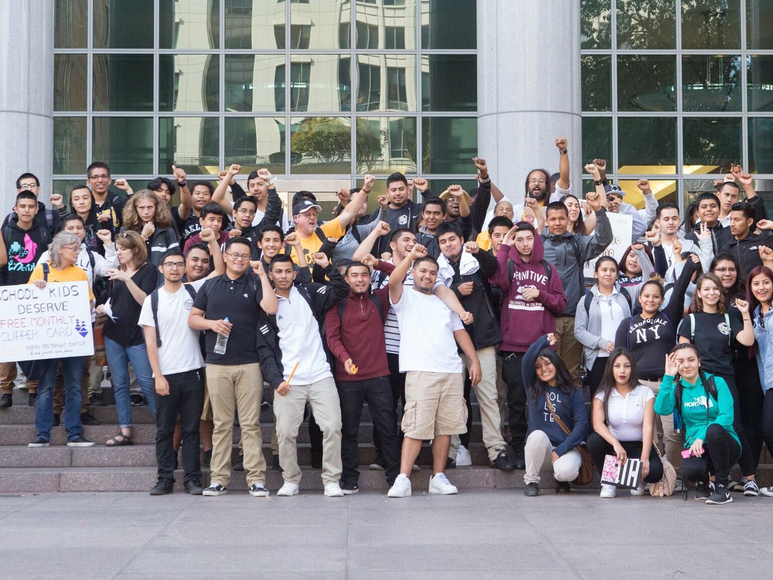 A large group of young adults pose for a picture for Urban Peace Movement