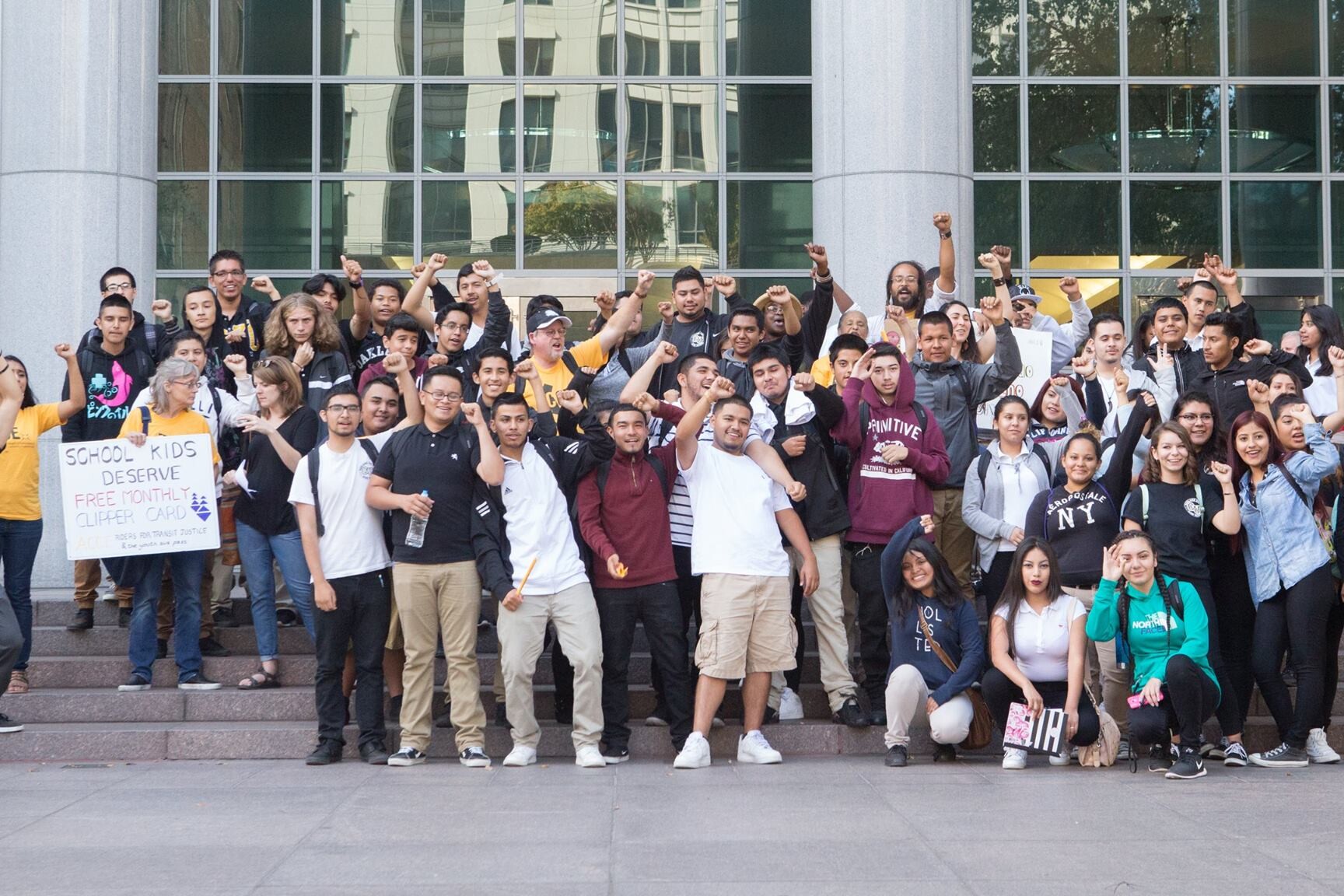 A large group of young adults pose for a picture for Urban Peace Movement