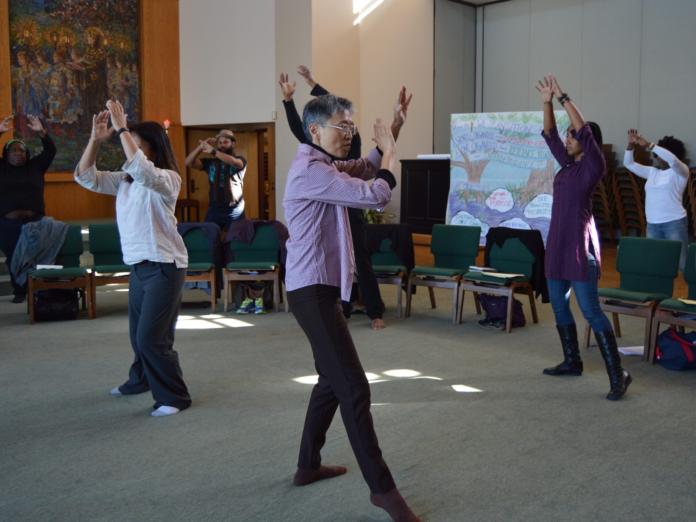 People participating in Tai Chi at Beloved Communities Network