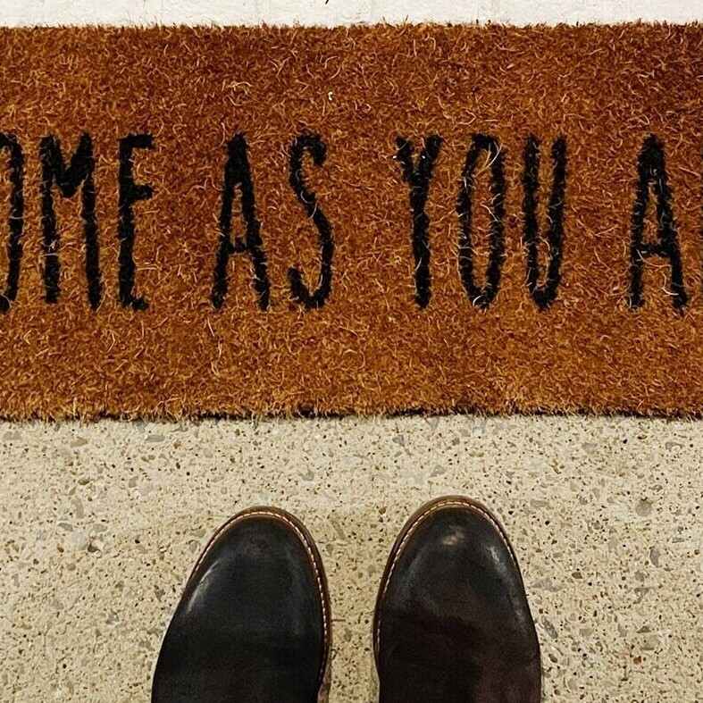 A door mat for After Incarceration that says 'Come As You Are'